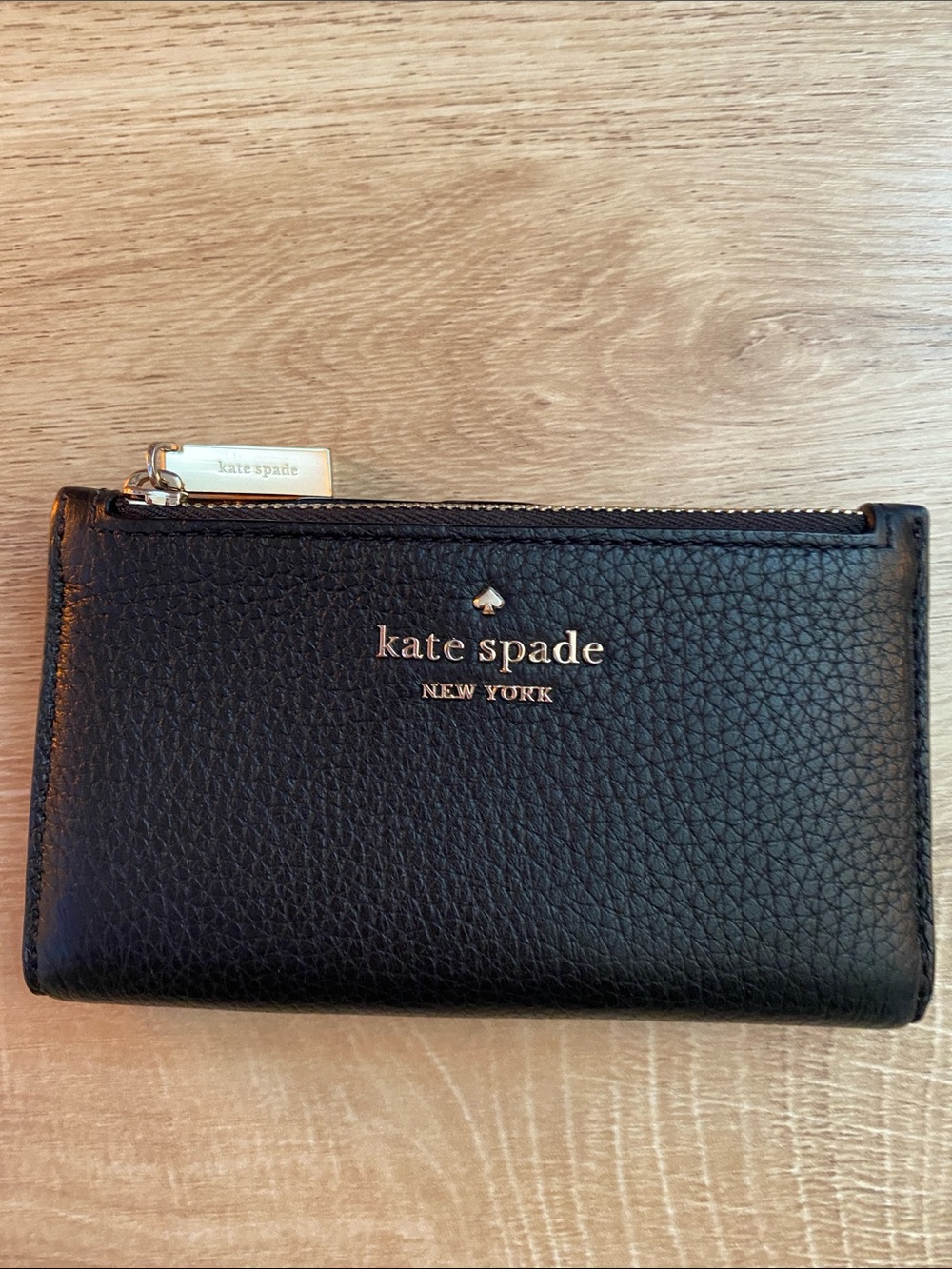 Like new! kate spade Black Pebbled Leather Zip-Around Wallet with Gold Logo